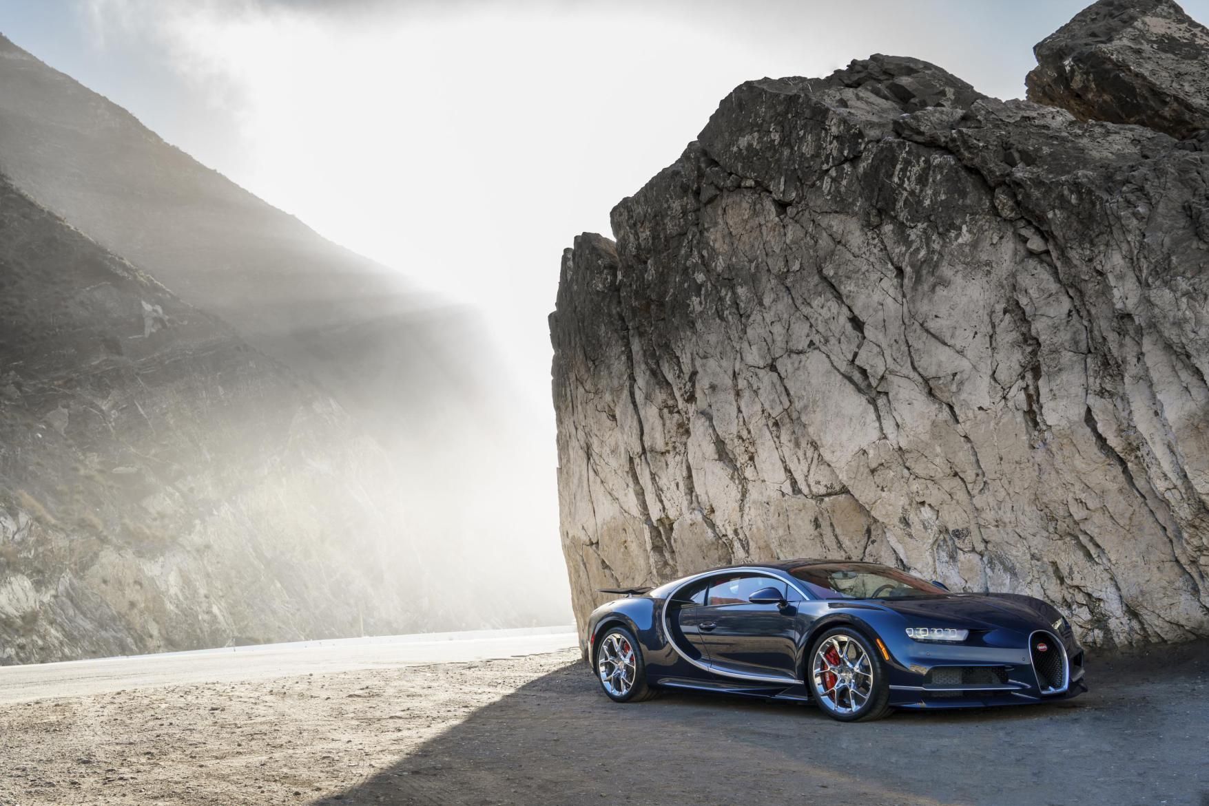 Huge, arcing air intakes, a nose of thrusting width and an octet of penetrating headlights underline the Chiron’s compelling absurd potency, but there’s class, too. 